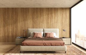 Quarto decorado com cama posta. Imagem disponível em Getty Images.