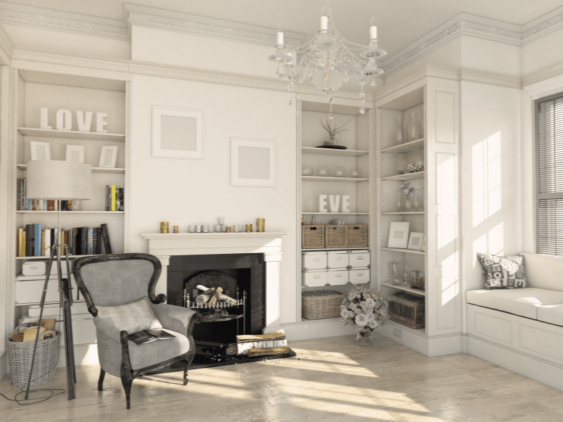 Sala com decoração clássica. Evidenciada pelo estilo do lustre, poltrona e cores mais elegantes. Imagem disponível em Canva.