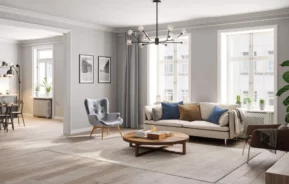 Imagem panorâmica do interior de uma sala de estar espaçosa e com móveis minimalistas para ilustrar matéria sobre o que é área útil