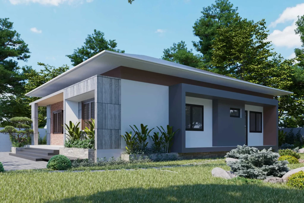 Imagem de uma casa térrea moderna com telhado plano, janelas grandes e uma mistura de paredes cinza e brancas. Plantas verdes exuberantes e grama cercam a casa, com árvores altas ao fundo sob um céu azul.